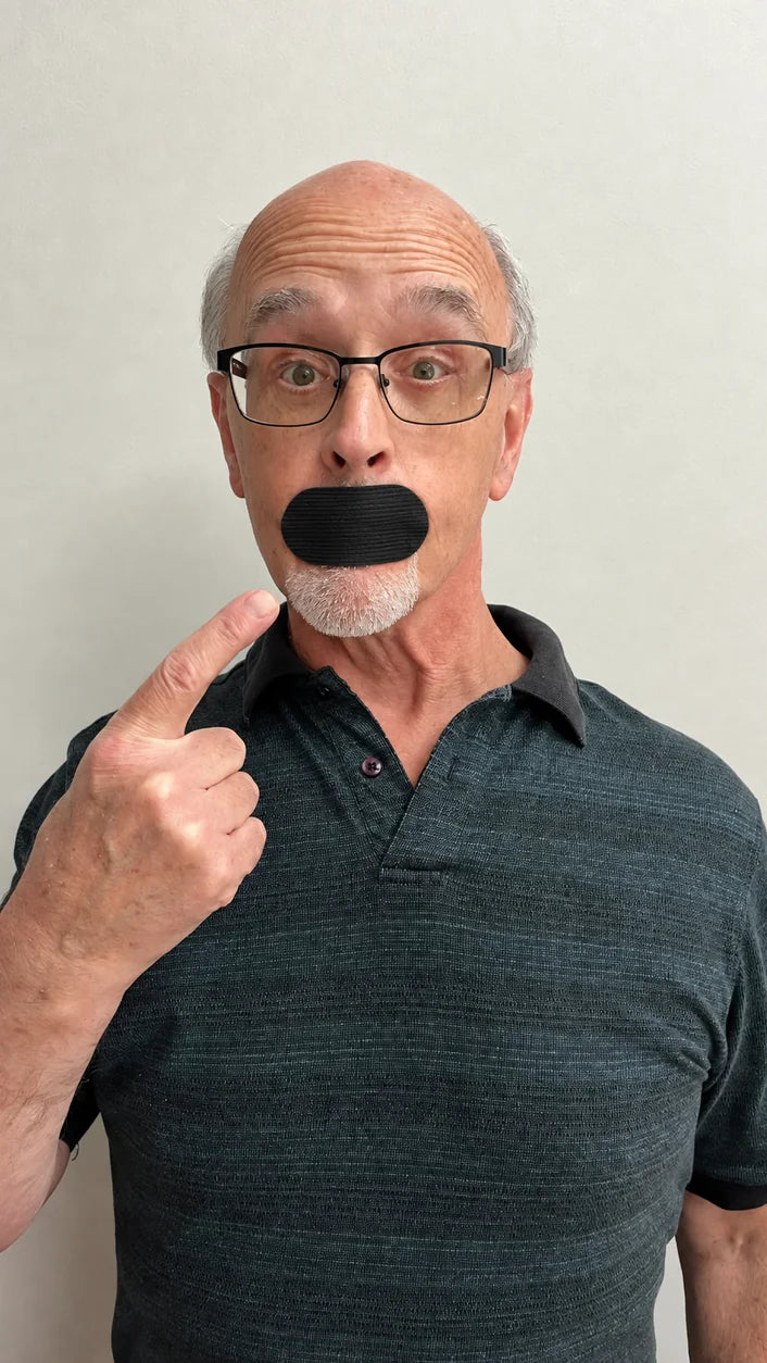 Man wearing black mouth tape