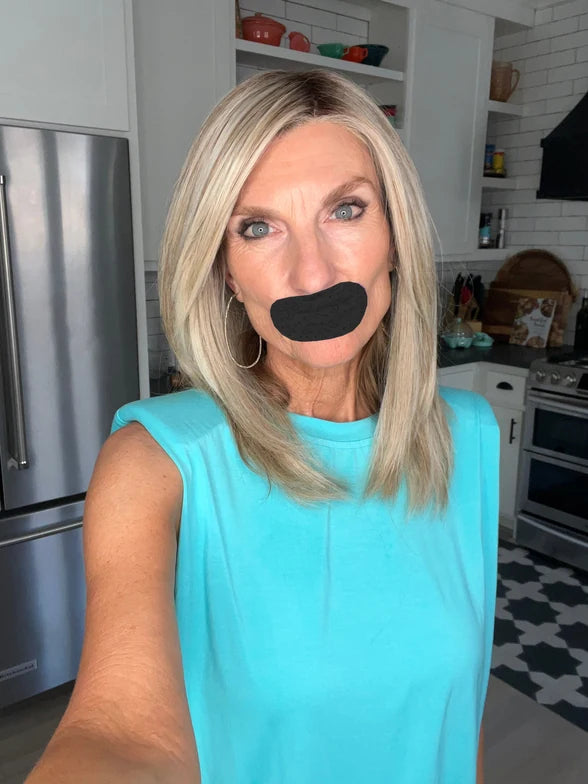 Anna wearing black mouth tape