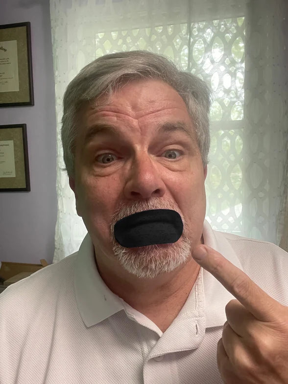 Frank wearing black mouth tape