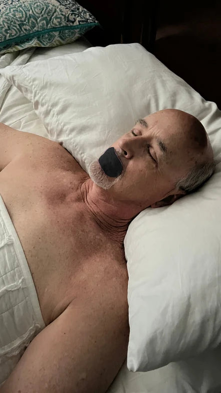 Larry wearing black mouth tape